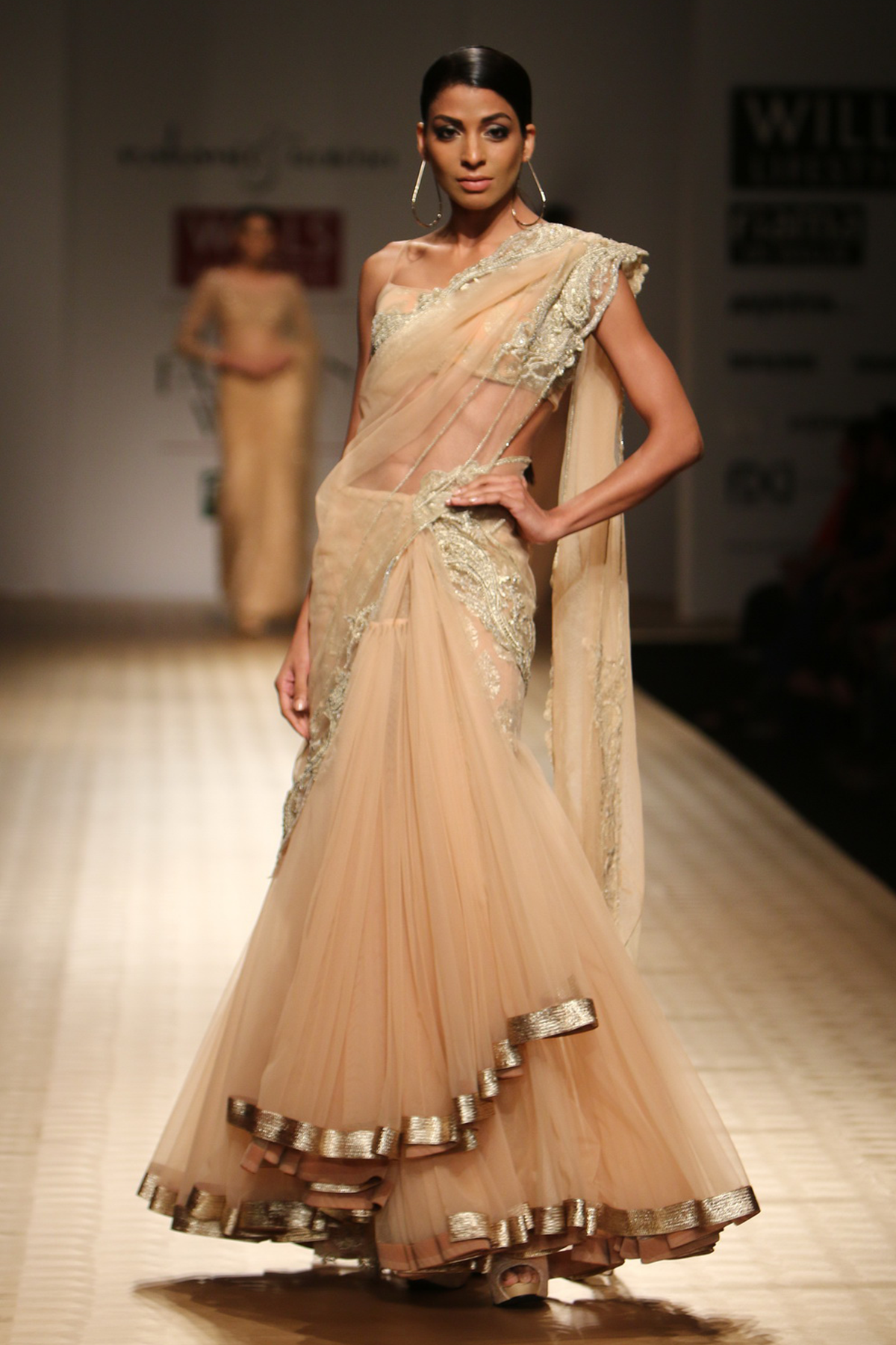 Sun Kissed Peach Net Frill Lehenga Sari with Paisley Border Drape with Booti Petticoat And Paisiley Bustier Blouse